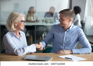 Happy Male Client Customer Employee Partner Handshake Old Broker Boss Hr Manager Sign Insurance Job Contract Agreement Take Bank Loan Buy Services Shake Hands Getting Hired At Office Business Meeting