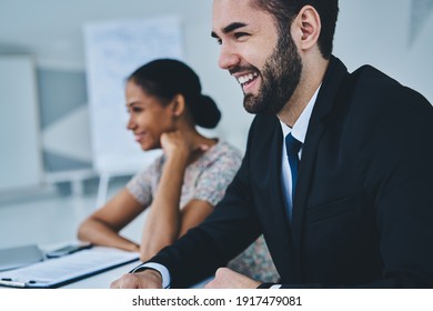 Happy Male And Female Colleagues Enjoying Positive Friendship Relations At Job Talking And Smiling During Work Time In Office Interior, Good Looking Business People Discussing Funny Experience