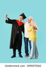 Happy Male Graduation Student With His Parents Taking Selfie On Color Background