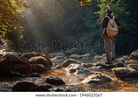 Similar – Image, Stock Photo Young hiker in river landscape