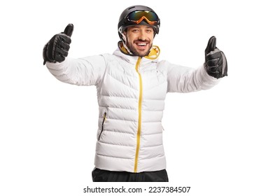 Happy male skier gesturing both thumbs up in front of camera isolated on white background