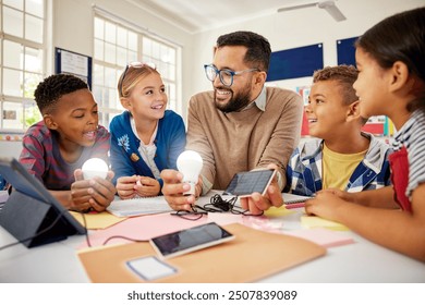 Happy male teacher with solar panel explaining pupil about solar energy with illuminated bulbs. Teacher in science classroom showing a solar panel to generate electricity, renewable energy. - Powered by Shutterstock