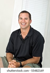 Happy Man Around 30 Years Old With Big Toothy Grin Portrait.