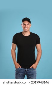 Happy Man In Black Cap And Tshirt On Light Blue Background. Mockup For Design