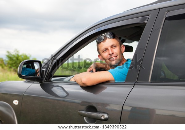happy man in the\
car