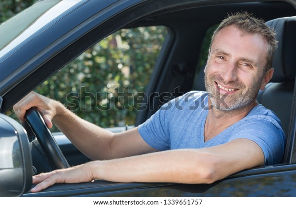 happy man in car
smiling