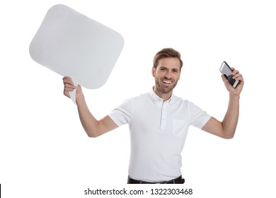 Happy Man Celebrates Good News With Hands In The Air Holding Phone And Speech Bubble On White Background