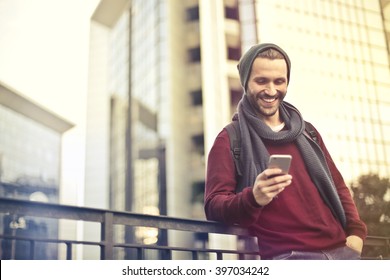 Happy Man Checking His Phone