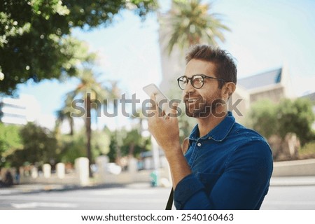 Happy man, city or talking with speaker phone for communication, audio message or voice note. Young, male person or tourist with smile on mobile smartphone for sound recording or app in an urban town