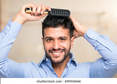 Happy Man Combing His Hair