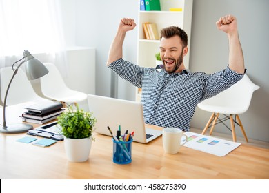 Happy Man Completed Task And Triumphing With Raised Hands