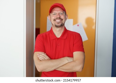 Happy Man Courier In Red Shirt And Cap Uniform, Delivery Worker