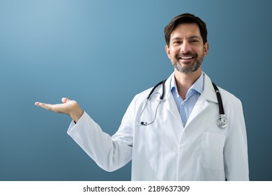 Happy Man Doctor In Labcoat Standing And Gesturing