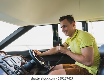 Happy Man Drive And Talk On Radio On Luxury Boat Yacht.