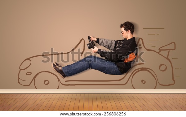 Happy\
man driving an hand drawn car on the wall\
concept