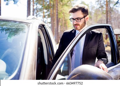 Happy Man Entering His Car