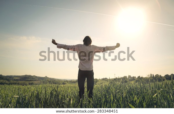 Happy Man Facing Sun Stock Photo (Edit Now) 283348451