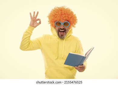 Happy Man In Funky Wig Show OK Sign Gesture Reading School Book In Geek Sunglasses, Education