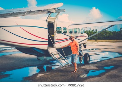 Happy Man Gets Into A Private Plane On The Islands