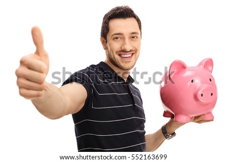 Happy man giving a thumb up and holding a piggybank isolated on white background