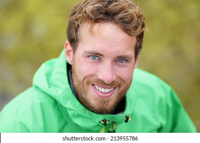 Happy Man Hiking Portrait In Nature Outdoors. Handsome Caucasian Male Smiling.