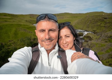 Happy man with his wife visiting Iceland in summer season. - Powered by Shutterstock