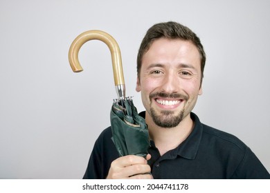 Happy Man Holding Closed Umbrella 