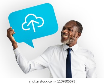 Happy man holding cloud computing symbol