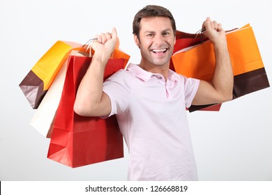 Happy Man Holding Shopping Bags