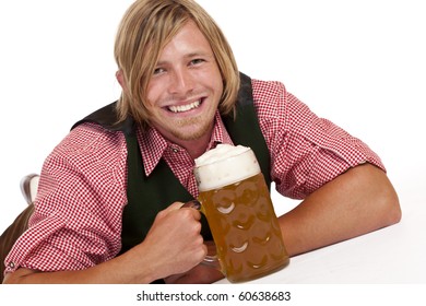 Happy Man Lying On Floor Holding Oktoberfest Beer Stein. Isolated On White Background.