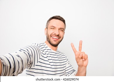 Happy Man Making Selfie And Showing Two Fingers