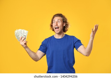 Happy Man With Money On Color Background