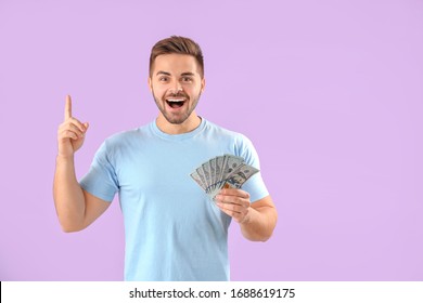 Happy Man With Money On Color Background
