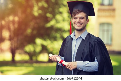 Happy Man Portrait On Her Graduation Day University. Education And People.