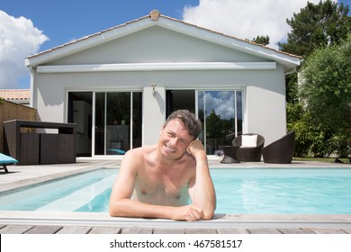 Happy Man In Private Swiming Pool In Front Of His House