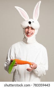 Happy Man In A Rabbit Costume With A Carrot	