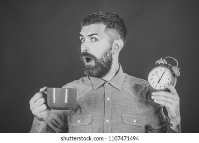 Happy Man. Red Mug With Alarm, Perfect Morning. Guy With Mulled Wine, Clock On Black Background. Refreshment Break And Energy. Man Drink Morning Coffee Or Tea With Alarm Clock. Hipster With Milk Cup