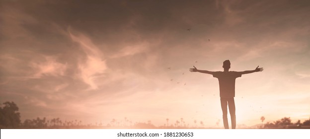 Happy man rise hand on morning view. Christian inspire praise God on good friday background. Male self confidence empowerment on mission arm courage nature the sun concept strength wisdom
