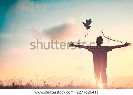 Happy man rise hand Worship God in morning view. Christian spirit prayer praise on good friday background. Male self confidence empowerment on mission arm concept strength wisdom ambitious