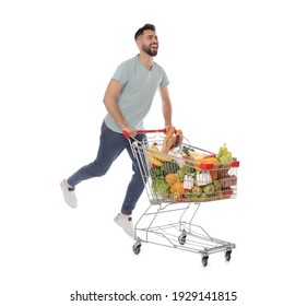 Happy Man With Shopping Cart Full Of Groceries On White Background