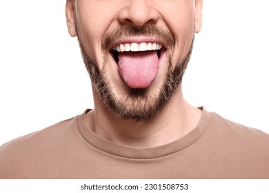 Happy man showing his tongue on white background, closeup