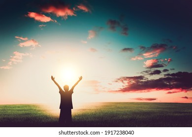 Happy Man Silhouette with Hands Up on the Nature Background