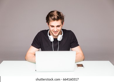 Happy Man Smiling In Front Of Laptop 