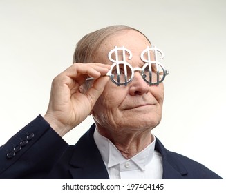 Happy Man In Suit Wearing Dollar Sign Glasses 