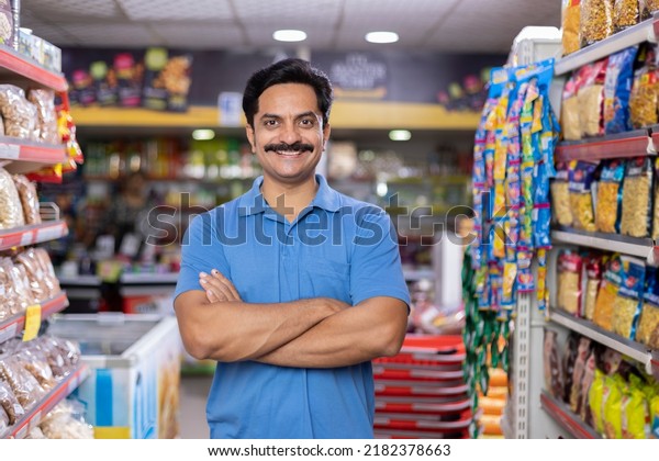 Happy man at supermarket\
store