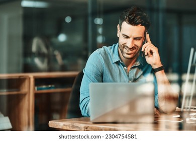 Happy man talking with phone at laptop in office, conversation and communication for online planning. Male worker, cellphone contact and call at computer for mobile networking in startup business - Powered by Shutterstock