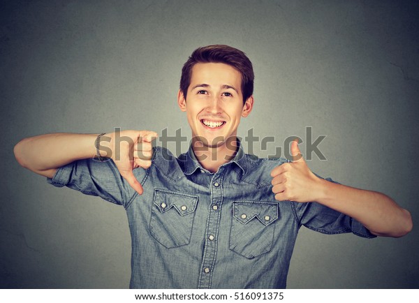 Happy man with\
thumbs down thumbs up\
gesture