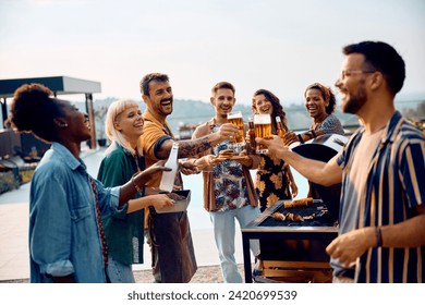 Happy man toasting with his friends while gathering with friends on a barbecue party.  - Powered by Shutterstock