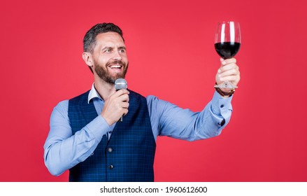 Happy Man Toastmaster Raise Glass Of Wine To Propose Toast Before Drinking Red Background, Cheers