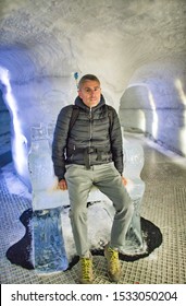 Happy Man Visiting Ice Cave In Iceland.